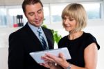 Secretary With Tablet Pc Discussing Bosses Schedule Stock Photo