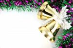 Golden Bell And Colorful Ribbons Stock Photo