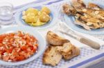 Grilled European Seabass With Potato And Tomato Salad Stock Photo