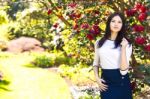 Young Beautiful Woman With Long Straight Dark Hair Posing In Spr Stock Photo