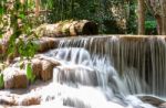 The Water Flowing Over Rocks And Trees Down A Waterfall At Huay Mae Khamin Waterfall National Park ,kanchana Buri In Thailand Stock Photo