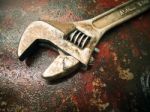 Old Wrench On The Fuel Tank Stock Photo