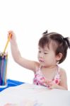 Little Girl Choosing Colour Pencil For Draw Picture Stock Photo