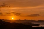 Sun Setting Beyond Palau In Sardinia Stock Photo