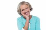 Shy And Polite Senior Smiling Woman Stock Photo