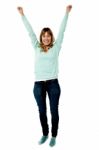 Female Raising Her Arms In Excitement Stock Photo