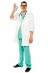 Male Doctor Showing Okay Gesture Stock Photo