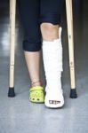 Injured Person With Crutches Stock Photo