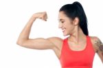 Female Trainer Showing Her Biceps Stock Photo