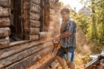 Man Sawing A Window Stock Photo