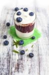 Glass Of Yogurt With Fresh Blueberries Stock Photo