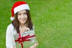 Santa Claus Hat With Red Christmas Gift Box Stock Photo