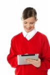 Smiling Girl Using Tablet Pc Stock Photo