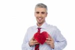 Smiling Man Holding A Gift Box Stock Photo