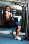 Man Exercising With Help Of A Hydraulic Equipment Stock Photo