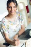 Pretty Young Woman Using Her Laptop In The Office Stock Photo