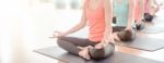 Asian Woman Doing Yoga Indoors Stock Photo