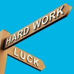 Hard Work Or Luck Directions Stock Photo