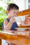 Little Asian Girl (thai)  Holding A Cup Stock Photo