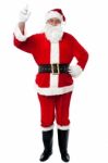 Bespectacled Santa Pointing Upwards Stock Photo