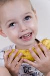 Little Boy Holding Banana Stock Photo