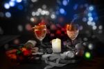 Two Glasses Of Champagne With A Christmas Decor In The Background Stock Photo