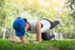 Hand Push-up. Confident Muscled Young Women Wearing Sport Wear A Stock Photo