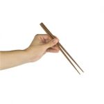 Hand Holding Chopsticks, Isolated On White Background Stock Photo