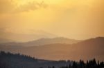 Sunny Spring Evening In Mountain Village. Fields And Hills Stock Photo