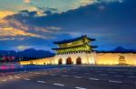 Geyongbokgung Palace And Car Light At Sunset In Seoul, South Korea Stock Photo