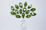 Glass Bottle With Jasmine Flower And Leaves Stock Photo