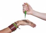 The Process Of Applying Mehendi On A Woman's Hand Stock Photo