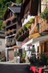 Colourful Pink Geraniums On A House In Hallstatt Stock Photo