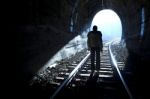 Man Standing In Train Tunnel Stock Photo