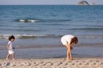 Asian Mom And Son On Beach Stock Photo