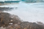 Waves Crashing On A Rock Stock Photo