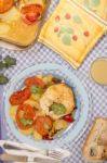 Fish With Potatoes And Tomato Stock Photo