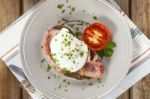 Poached Egg And Bacon On Rye Bread, Healthy Breakfast Stock Photo