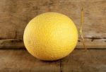 Yellow Cantaloupe Melon On The Wooden Background Stock Photo