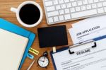 Job Search With Blank Sign On Computer Desk Stock Photo