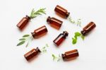 Top View, Bottle Of Essential Oil With Herbs  Sage, Rosemary, Or Stock Photo