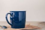 Blue Cup On Wooden Stock Photo