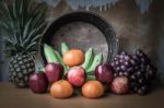 Apple And Several Kinds Of Fruits On A Wooden Table Stock Photo