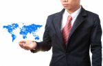 Hand Of Business Man And Blue World Map Stock Photo