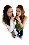 High Angle View Of Girls Shushing Stock Photo