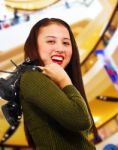 Smiling Teenager In A Shopping Center Stock Photo