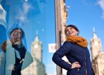 Girl Is Looking At Shop Window Stock Photo