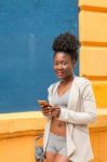 Young African Woman With A Smartphone Stock Photo