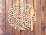 Round Rope Napkin Or Stand And Spoon On A Wooden Rustic Table. T Stock Photo