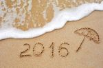 Inscription Of The Year 2016 Written In The Wet Yellow Beach Sa Stock Photo